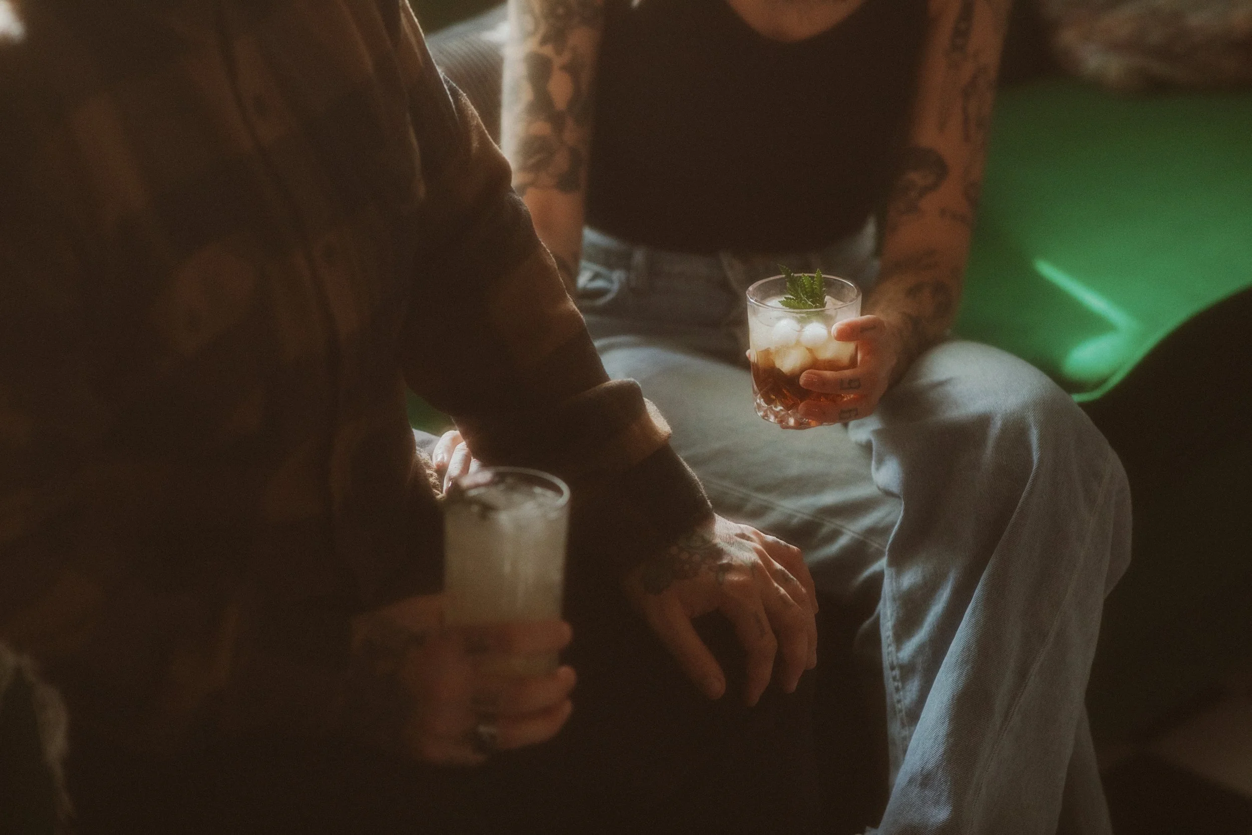 Close-up of a couple holding drinks at their intimate elopement