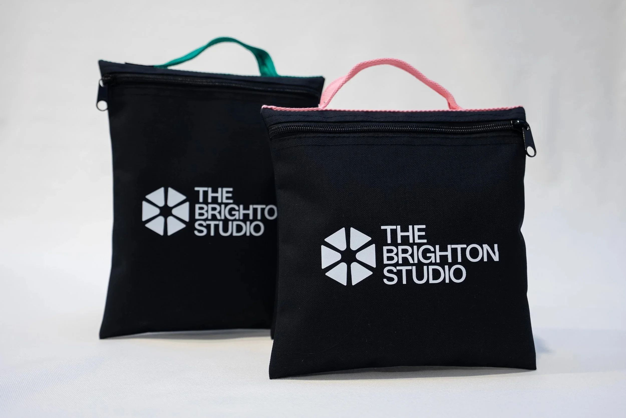 Custom-made black 1000D nylon, durable sandbags for photography with zipper closures and webbing handles with DTF printed logos