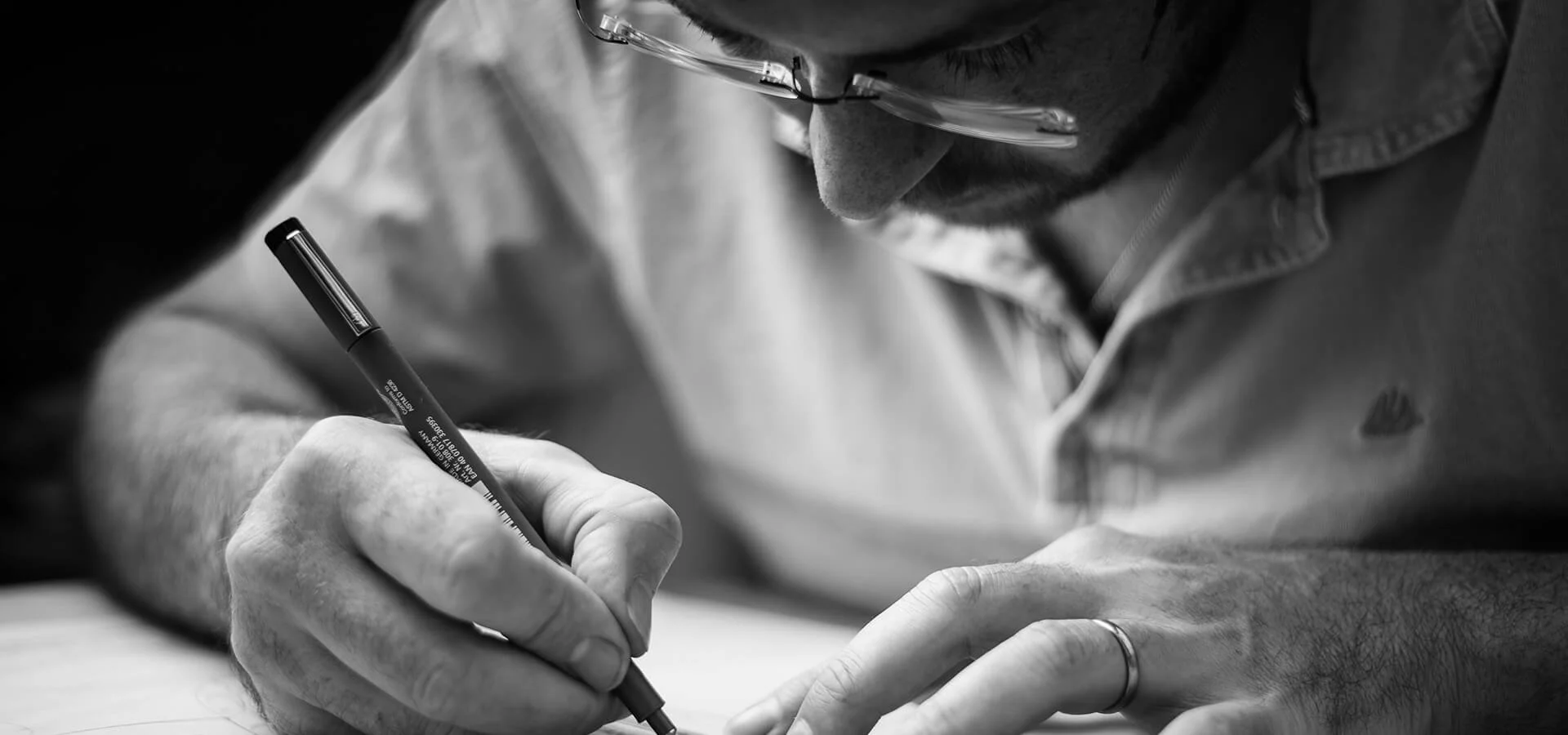 Owner of OX Garden design, Jason Benfield seen drawing up designs for a client.