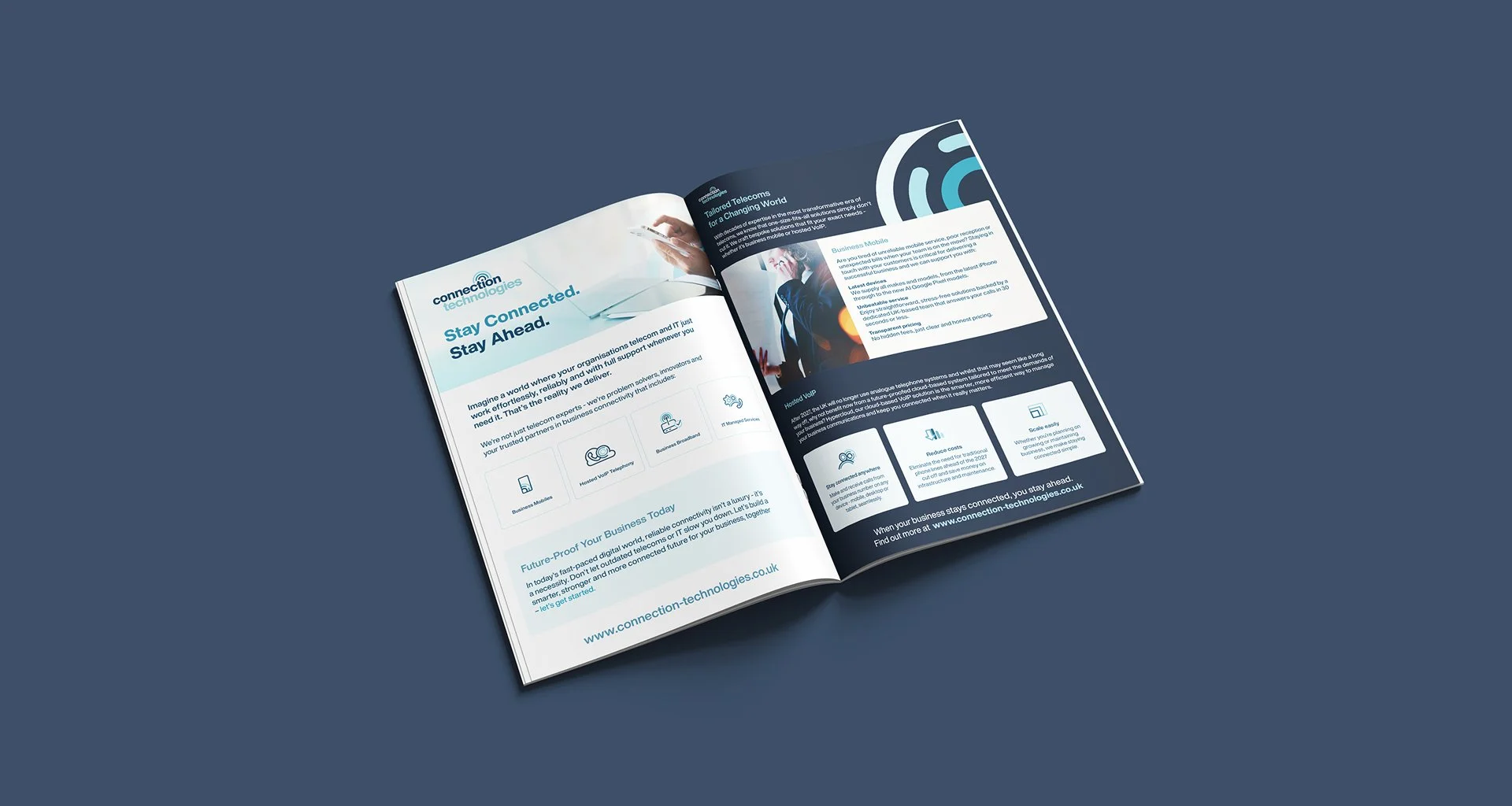 Open brochure on a blue surface showing telecommunications and connectivity information with images and icons.