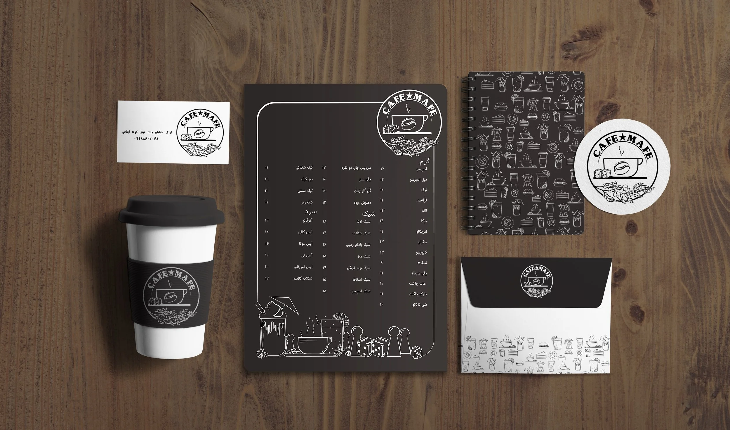 Top view of a wooden table with cafe branding, featuring a coffee cup with sleeve, a spiral notepad with cafe illustrations, a menu in Persian, and two printed stickers with cafe logo.