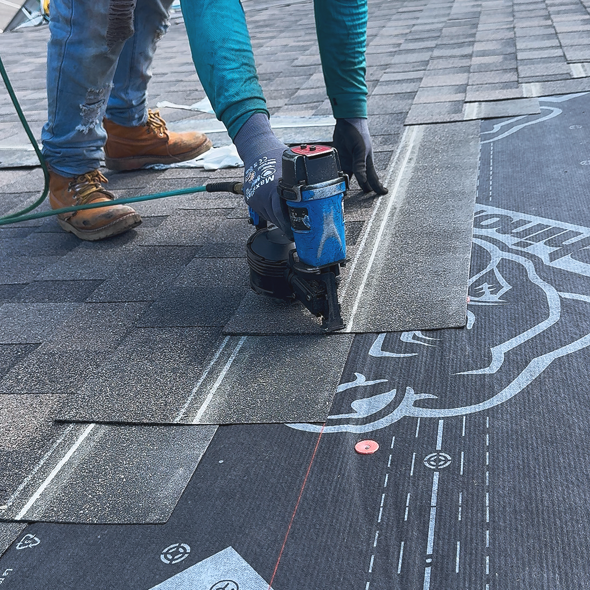 Citadel Construction roofing contractor installing asphalt shingles over synthetic underlayment during a roof replacement