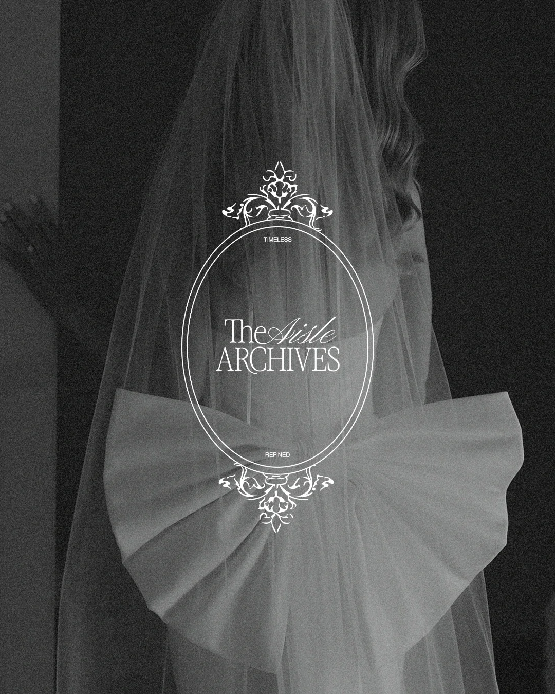 Black and white photo of a wedding veil and dress with decorative text overlay that reads "The Aisle Archives" and the words "timeless" and "refined" at the top and bottom of an ornate oval frame.