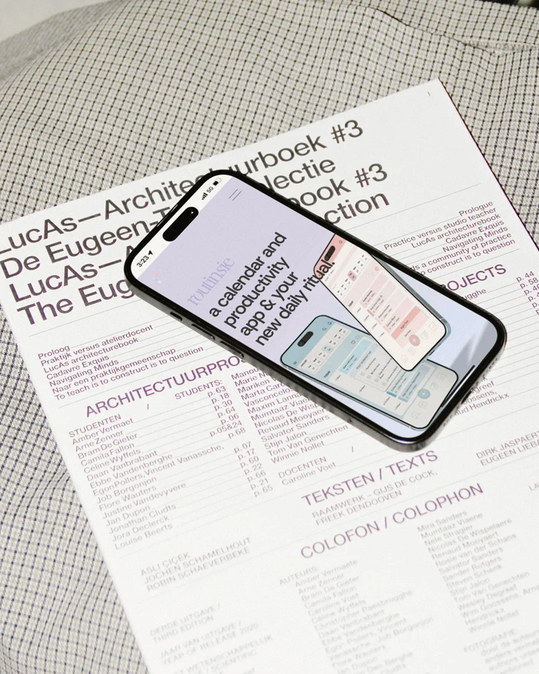 The image shows a printed document titled 'Routinsie', with a smartphone placed on top of it displaying a calendar app and productivity app, both showing similar app screens.