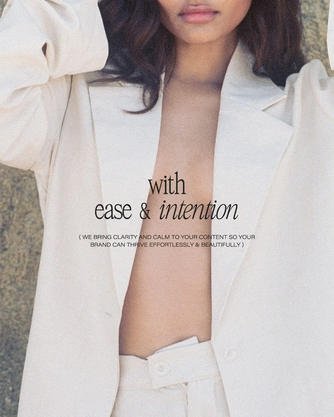 Close-up of a woman wearing a white blazer and trousers, with text overlay that says 'with ease & intention' and a smaller line of text reading 'we bring clarity and calm to your content so your brand can thrive effortlessly & beautifully'.