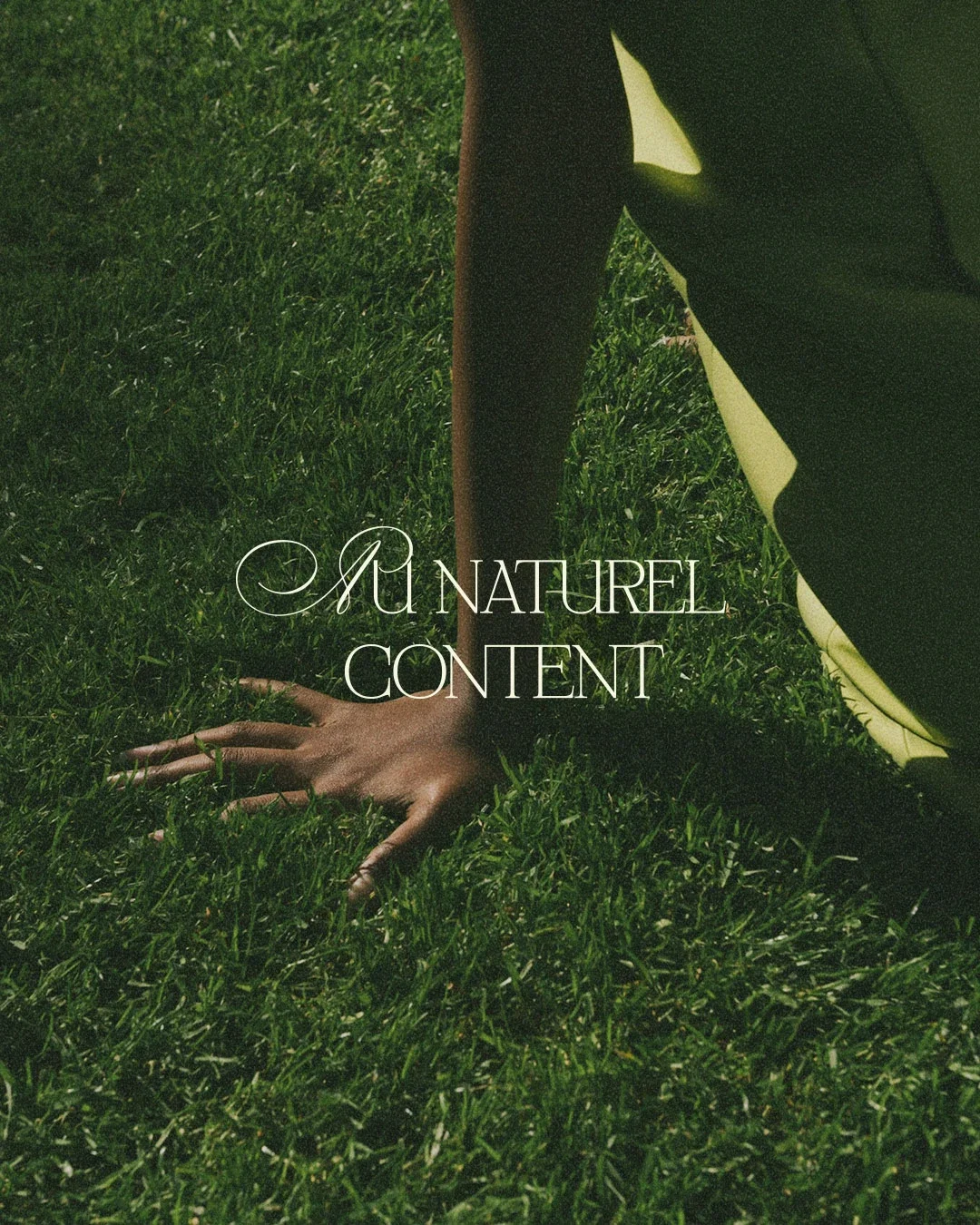 Close-up of a person on all fours on green grass, with text overlay reading 'AU NATUREL CONTENT'.