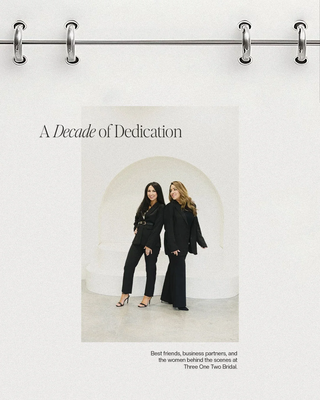Photograph of two women standing together, dressed in black business attire, smiling. Text above reads "A Decade of Dedication," and there is a caption below that says "Best friends, business partners, and the women behind the scenes at Three One Two Bridal."