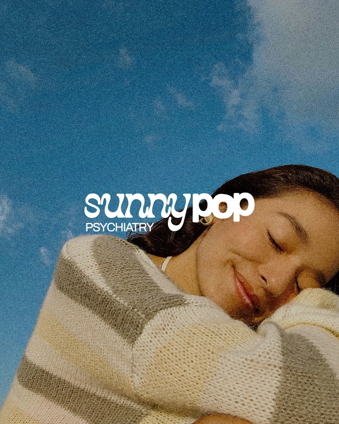A young woman with her eyes closed, resting her head on her crossed arms against a clear blue sky. Text overlay reads 'sunny pop psychiatry'.