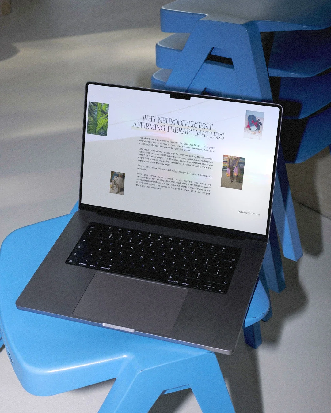 Laptop on a blue chair displaying a webpage about neurodivergent affirming therapy, with a blue stackable chair behind it.