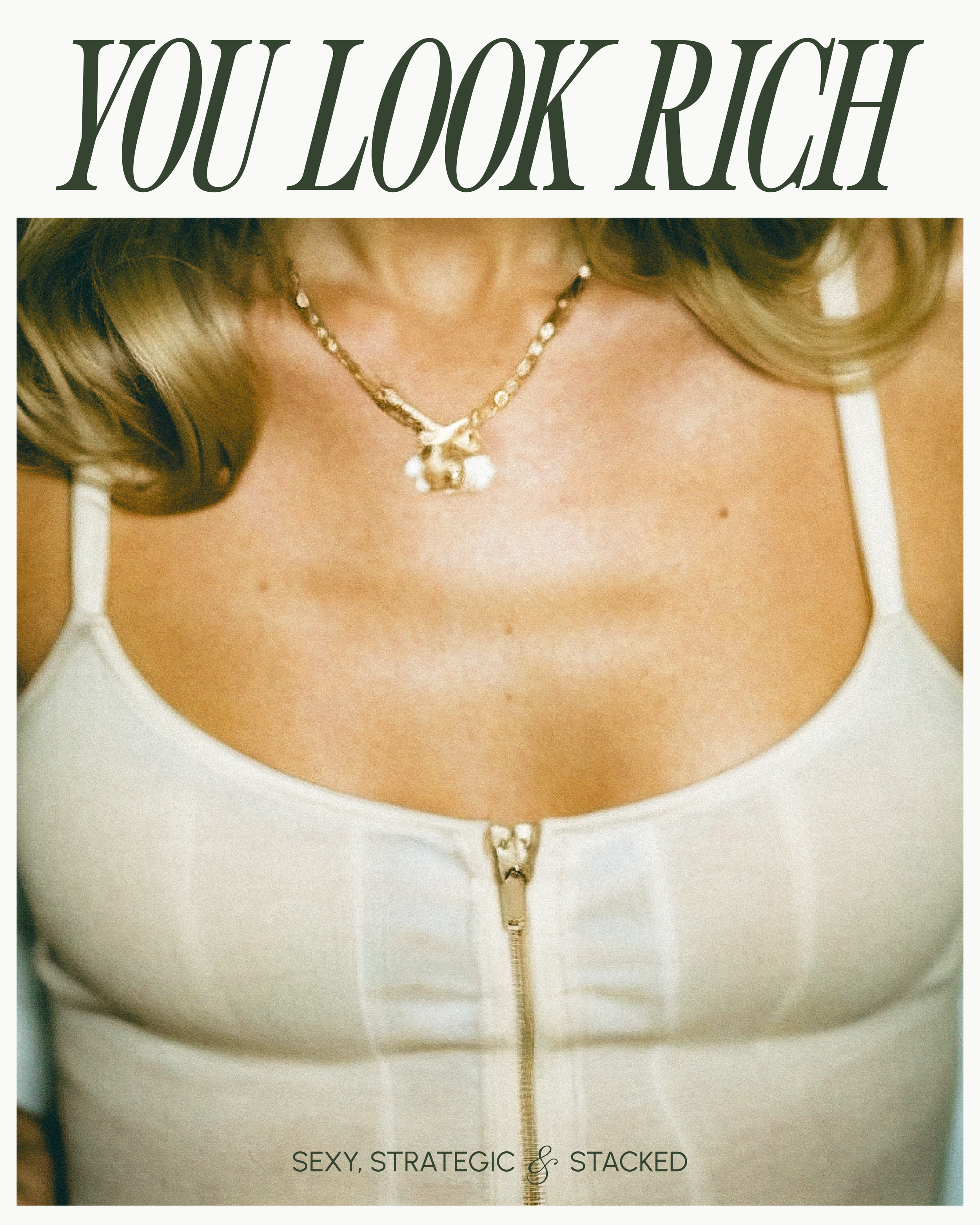Close-up of a woman wearing a white zipper top, a gold necklace with pearls, and gray hair styled in curls with a text in large serif that reads "YOU LOOK RICH."