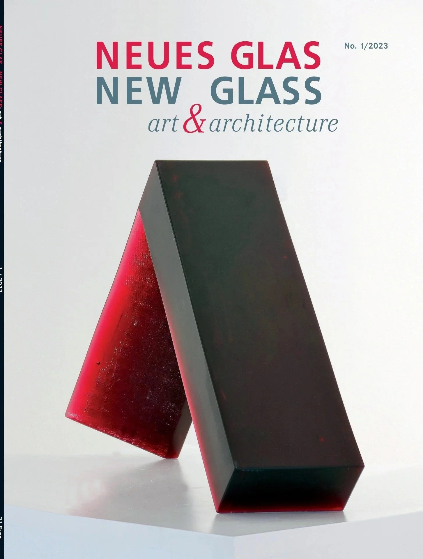 Cover of a magazine titled 'Neues Glas, New Glass: Art & Architecture,' featuring two large glass sculptures, one red and one black, with a white background.