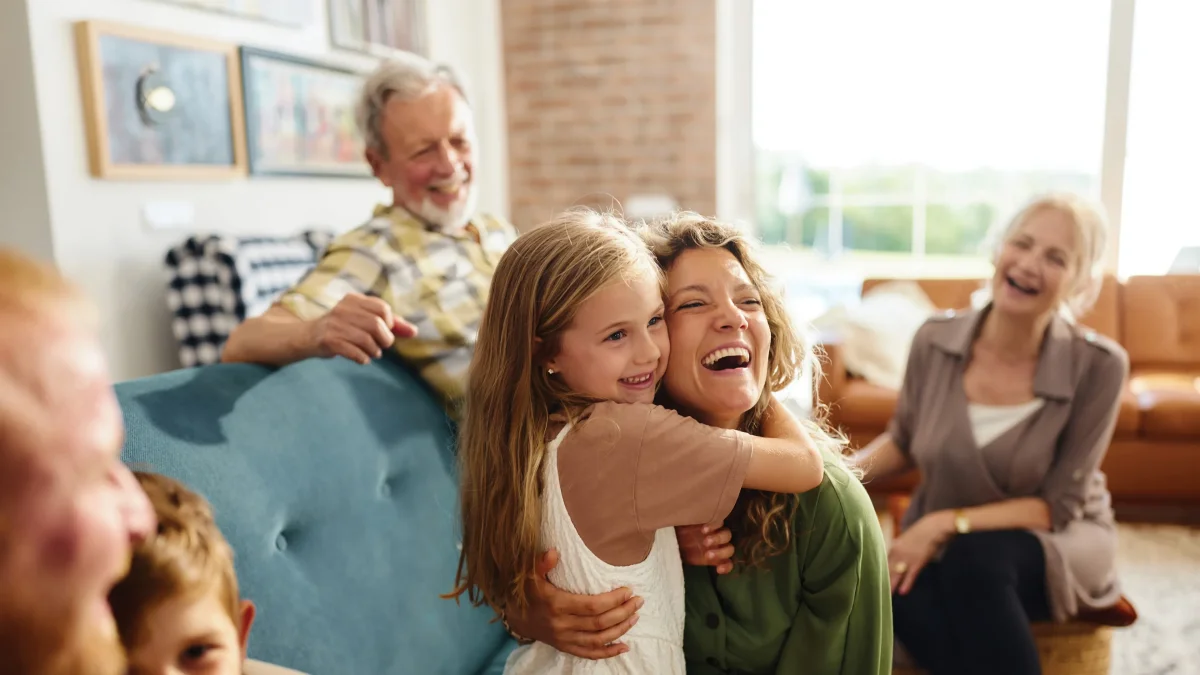 Happy family gathering with grandparents, mother and granddaughter