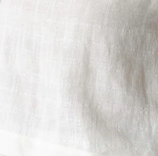 Cloud fabric in ivory, 87% linen and 13% cotton, breathable natural textile handcrafted into luxury sleepwear and loungewear on Bowen Island