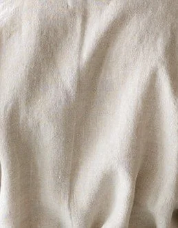 Sand soft beige fabric in 100% linen, breathable lightweight natural textile handcrafted into luxury pajamas and loungewear on Bowen Island