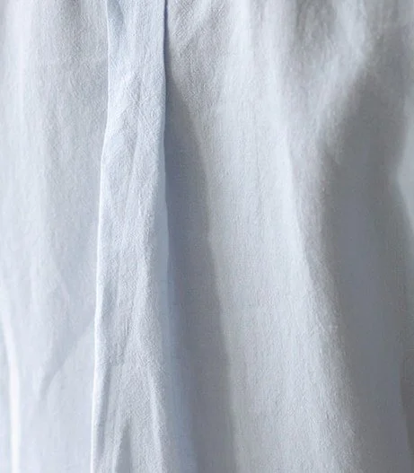 Sky pale blue fabric in 100% linen, airy lightweight natural textile handcrafted into Canadian linen loungewear and luxury pajamas on Bowen Island