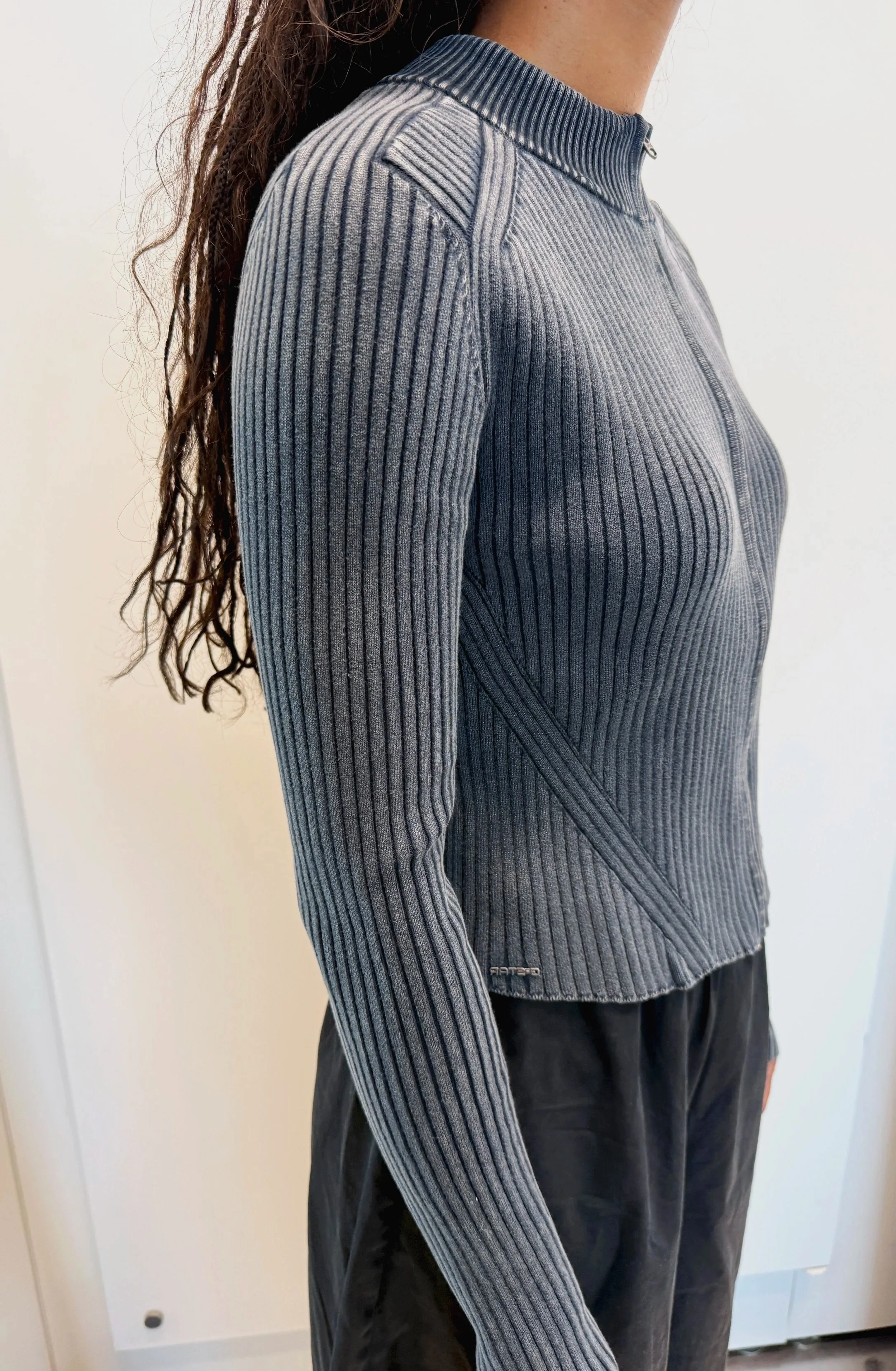 detail photo of knitwear with rib details in moto style, washed effect