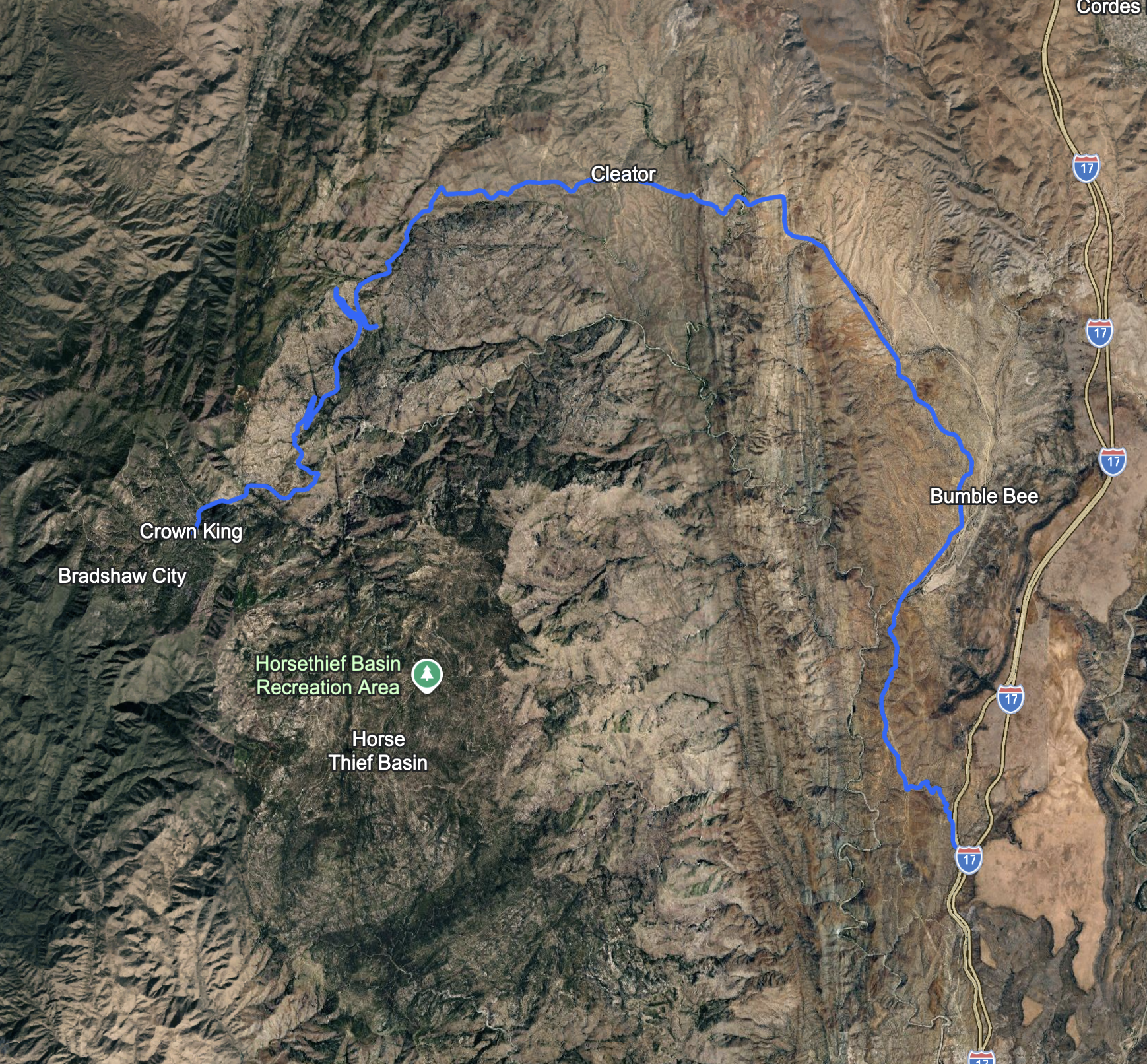Map of a hiking trail around Castle Creek Wilderness, showing a red trail line that loops from the right side near Bumble Bee, passes through Bumbee Bee, follows a path near Sheep Gulch Spring and Cordes Cabin Spring, and circles back to the starting point near the highway.