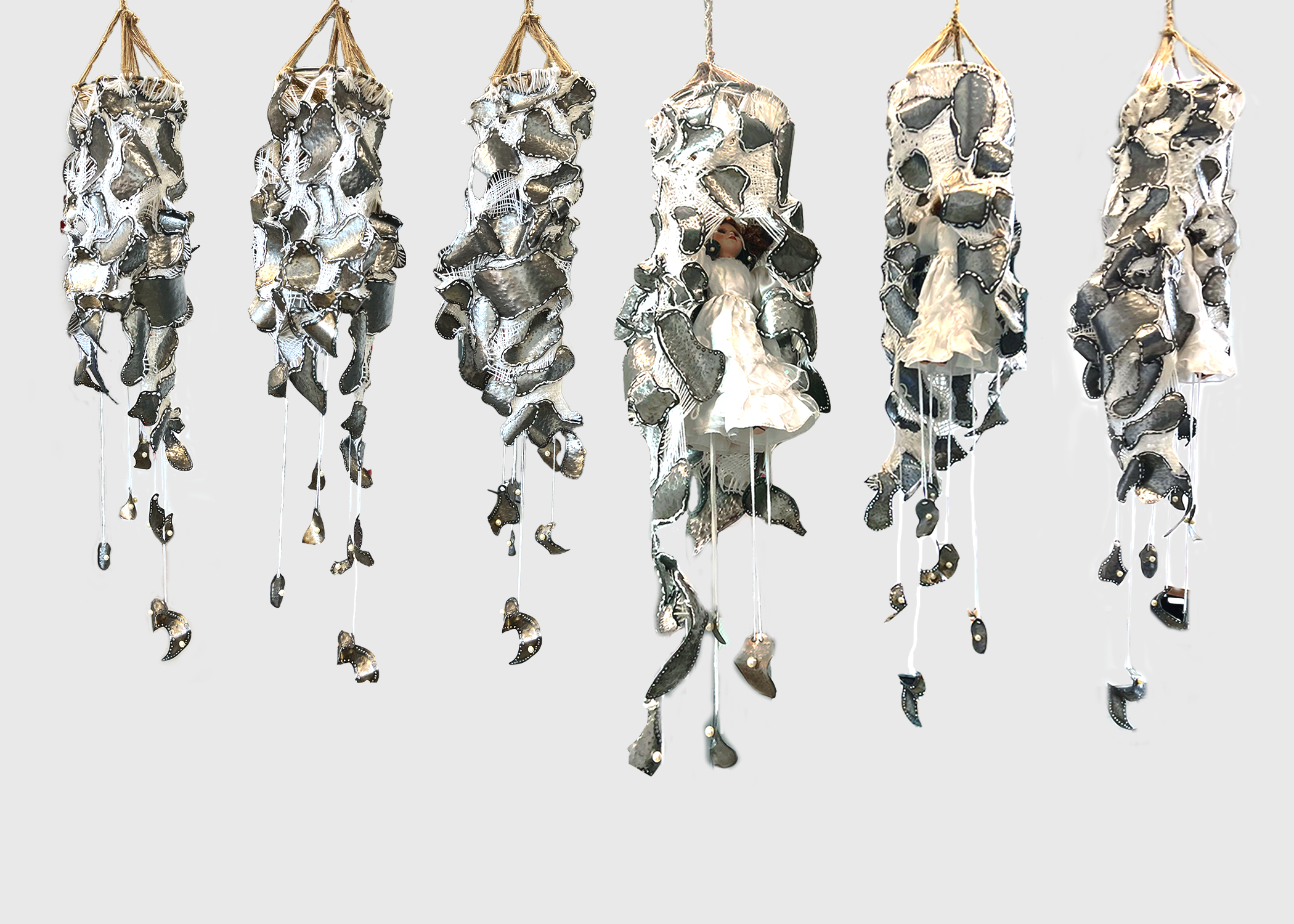 "Womb of Steel" (16"x65") steel, yarn, twine; found pearls and porcelain doll