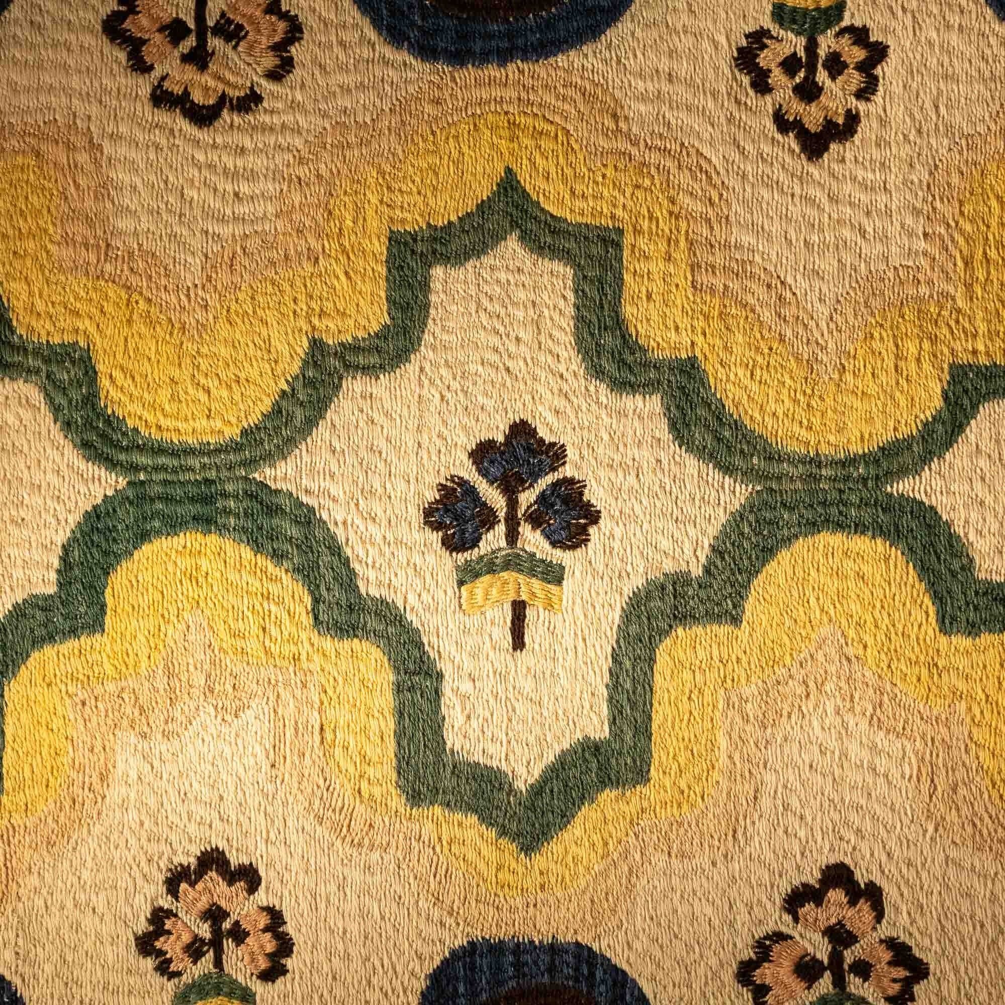 Colcha Embroidery – Floral Design • This vibrant floral embroidery is an example of traditional Colcha stitchwork, using hand-dyed wool on natural fabric. The design reflects the enduring beauty of New Mexican textile traditions.