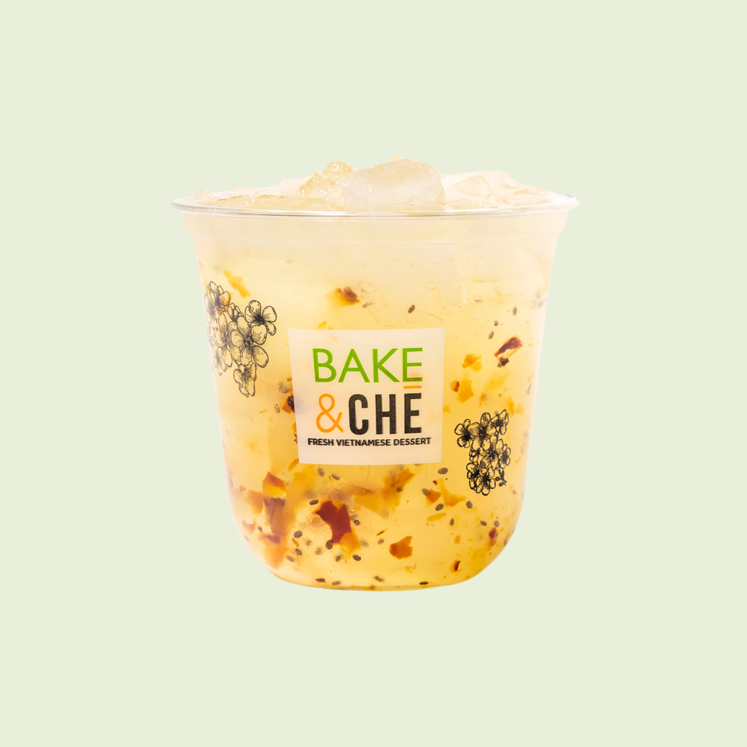 Vietnamese dessert in a clear cup with black and orange text and floral illustrations on a mint green background.