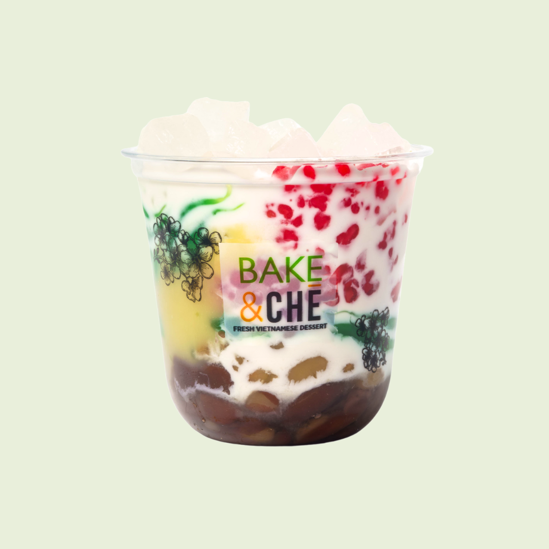 A cup of Vietnamese dessert with layered ingredients, including red beans, jelly, and coconut milk, labeled 'Bake & Che'.