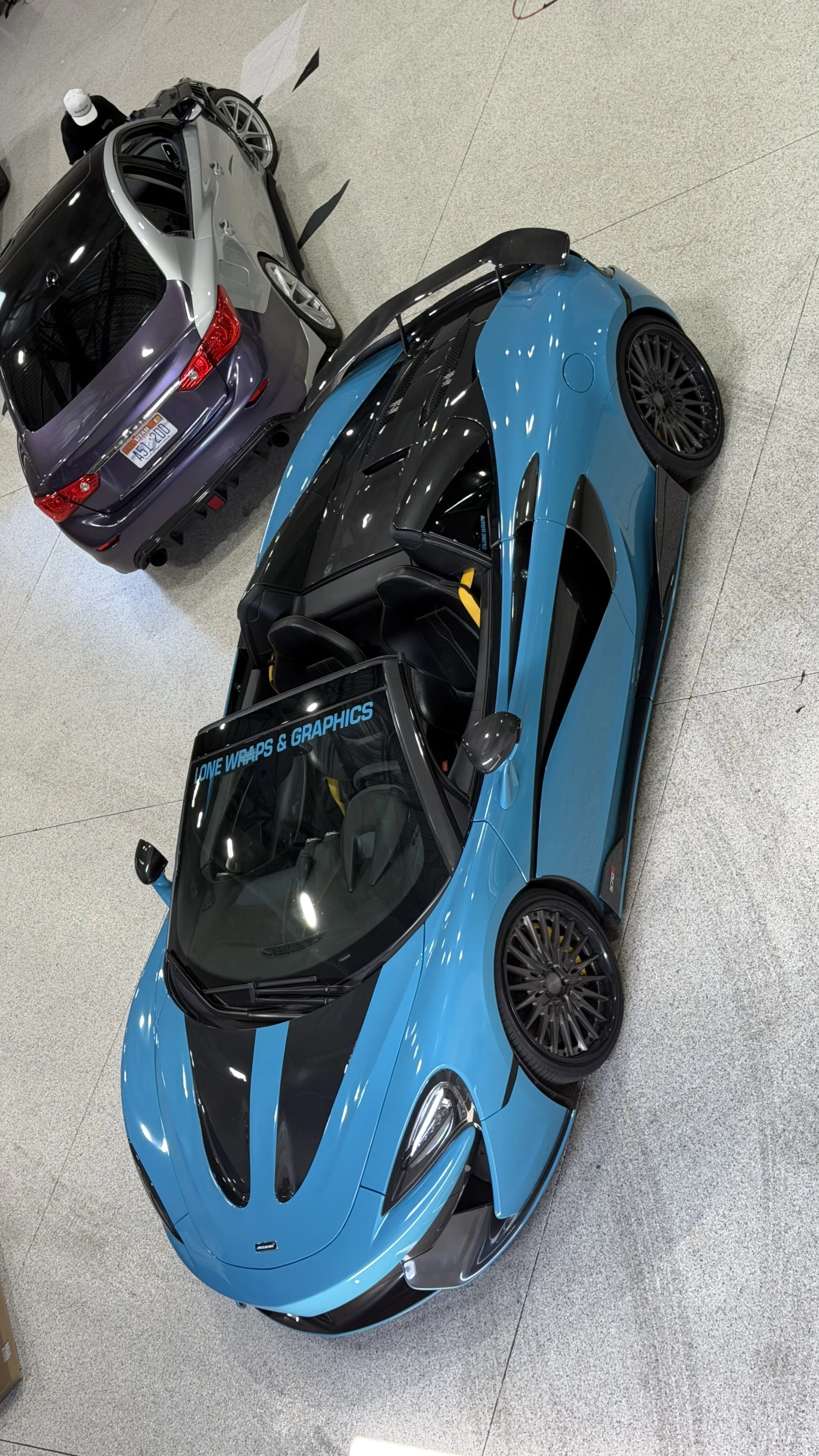 Blue Mclaren fully wrapped in Avery Dennison aqua blue