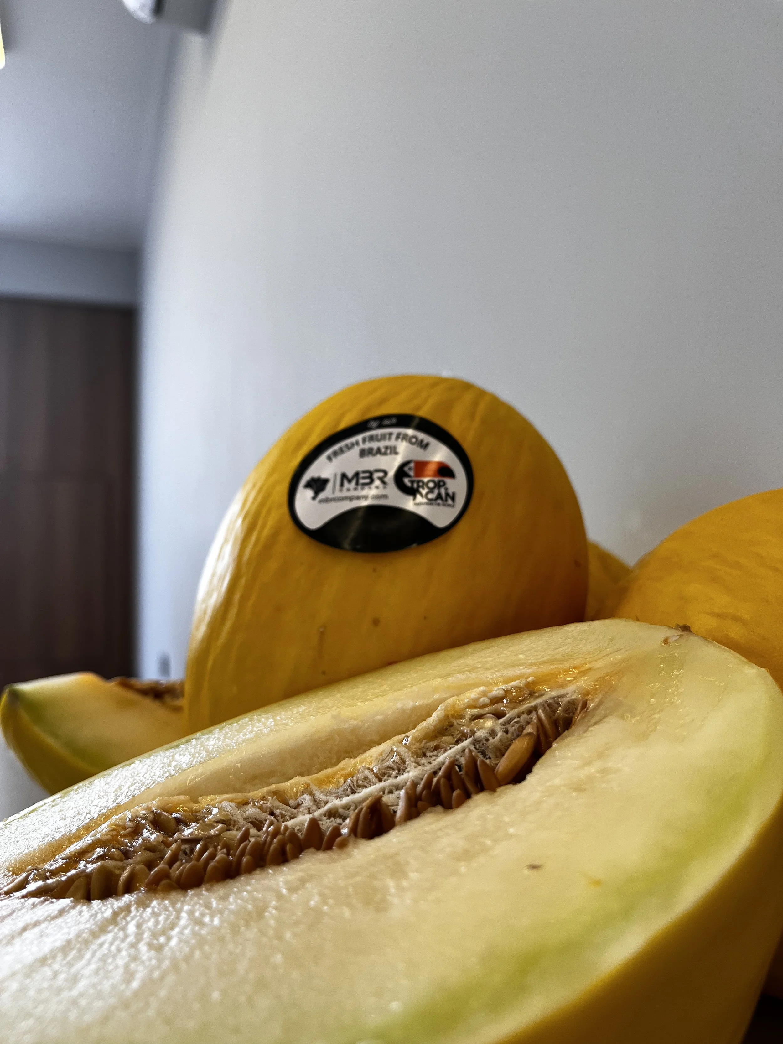 Yellow melon cut half and melon with mbr tropcan export sticker