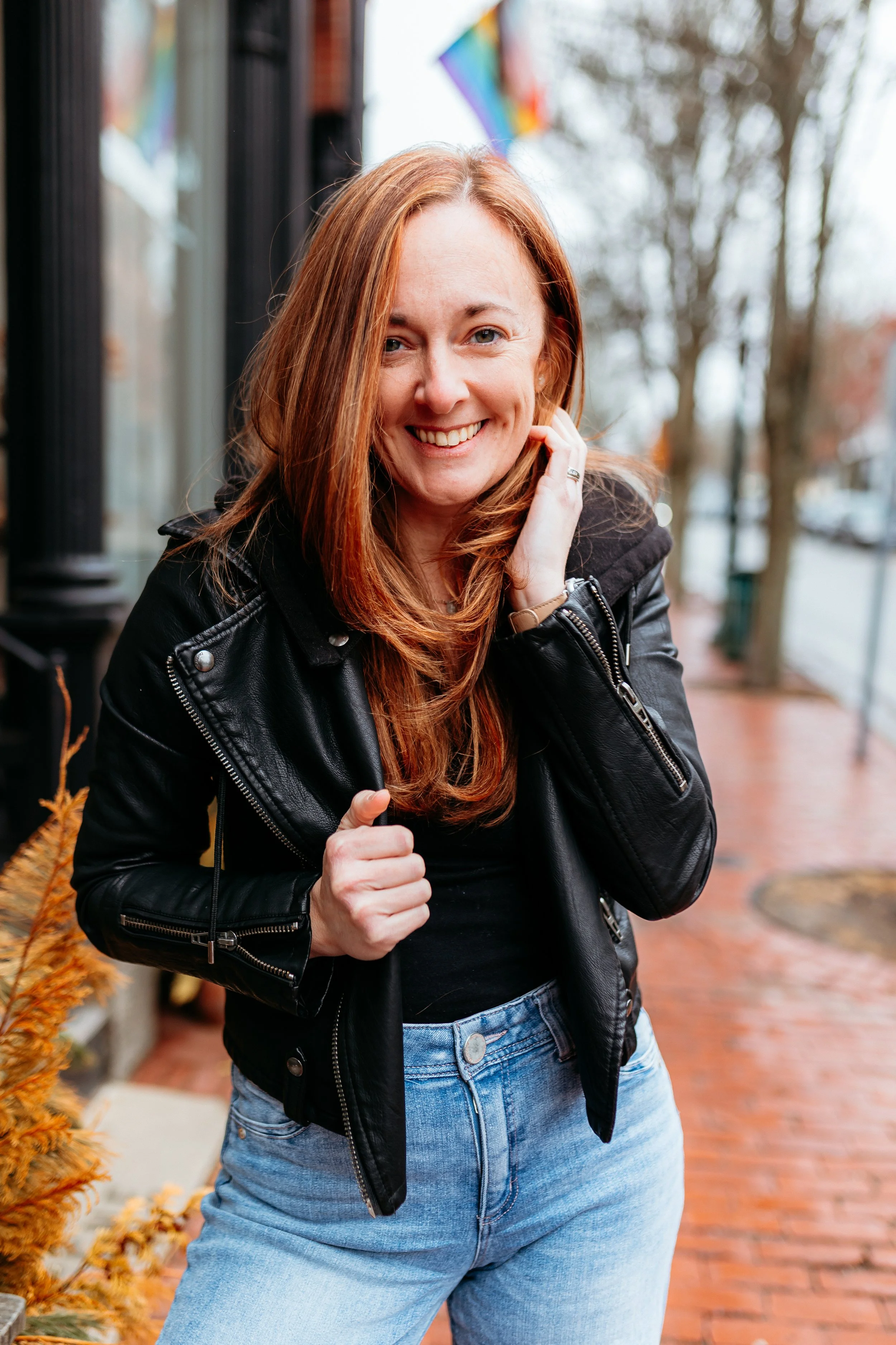 Photo of UpNext COO, Rachel McPherson holding a laptop