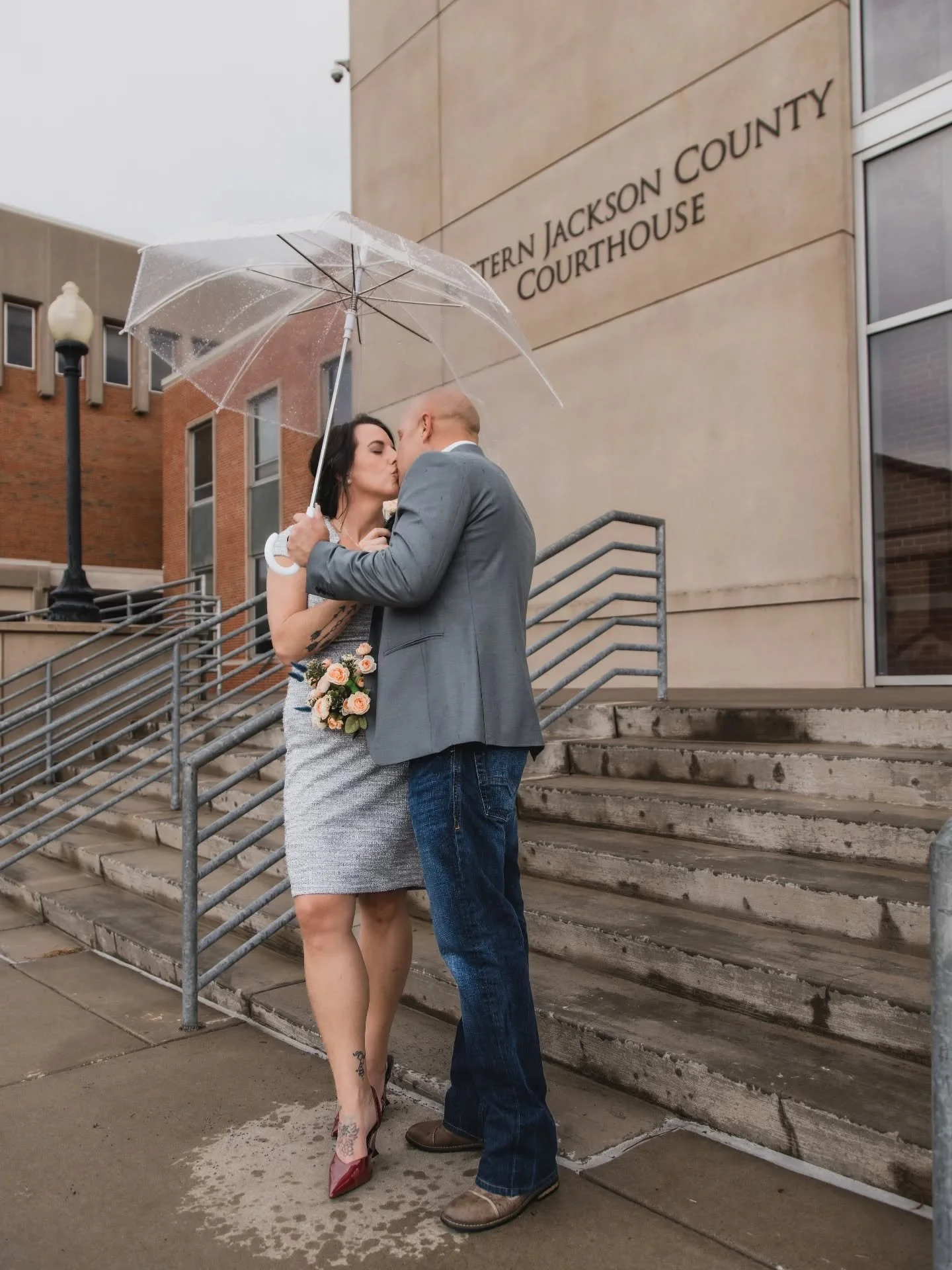 Eloping at the courthouse on a rainy weekday? Yes please! 
Moody skies and rainy weather make for such beautiful portraits!! Here in the Midwest, we don't cancel for light rain, we roll with it and call it drama!!