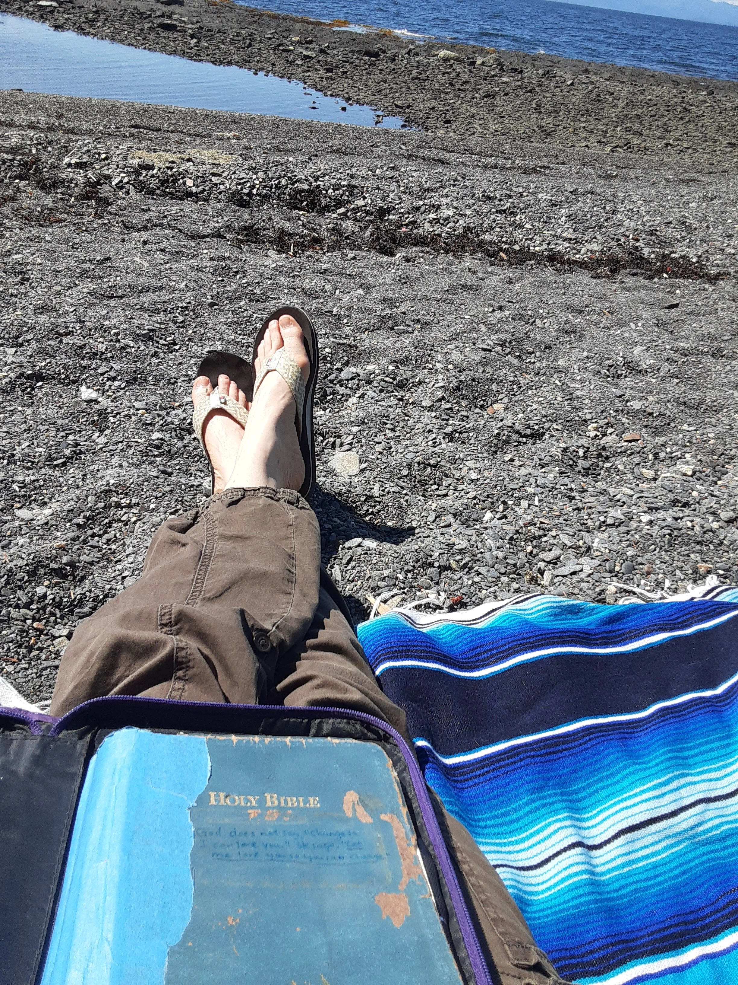 Dawn Hill's bio page.  Author of Journey into Trust with her well-worn Bible at one of her favorite beaches in Southeast Alaska.