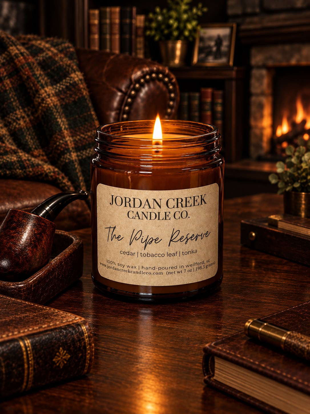 The Pipe Reserve Candle sitting on a wood desk