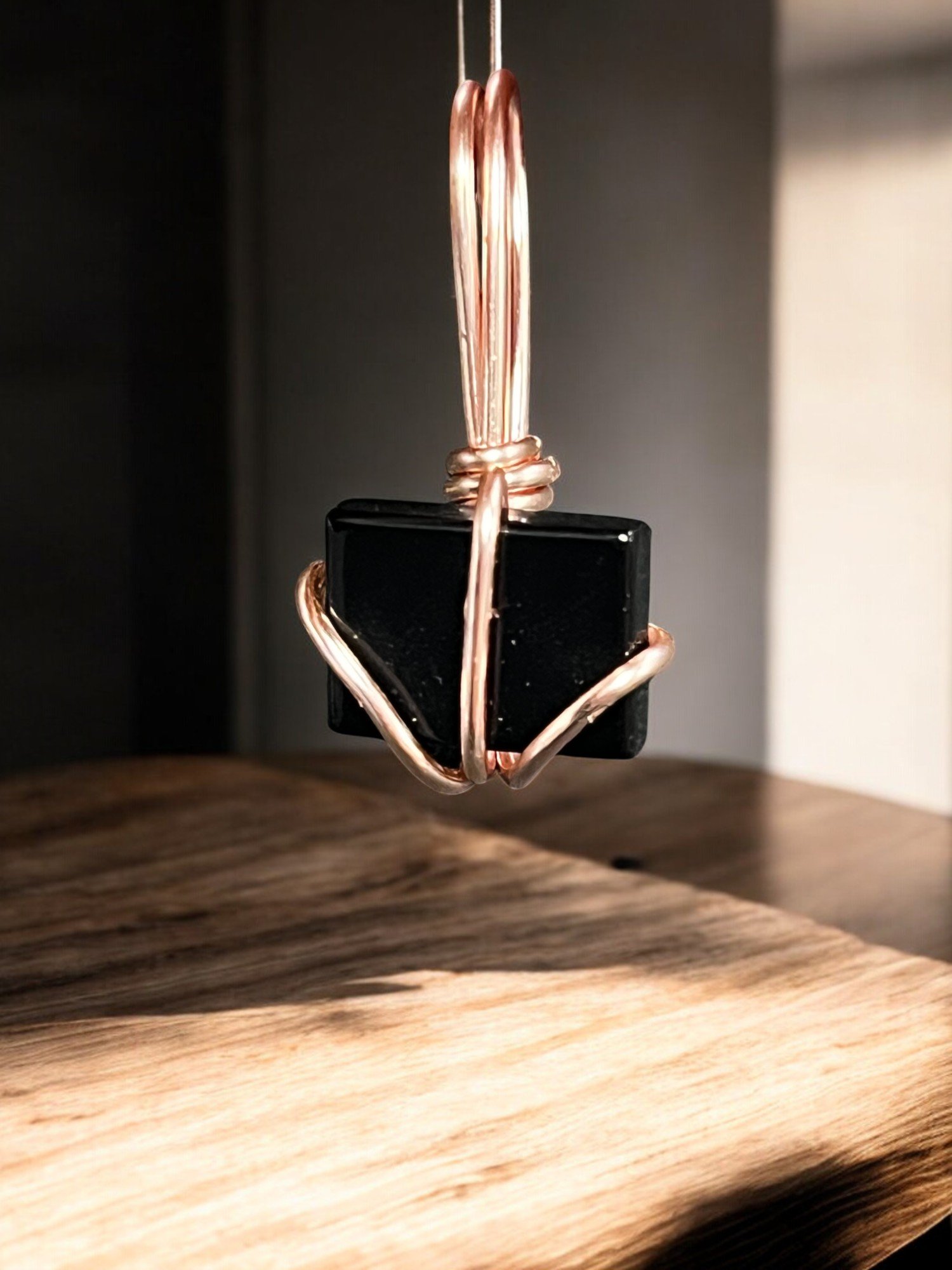 Black obsidian in rose gold tone wire