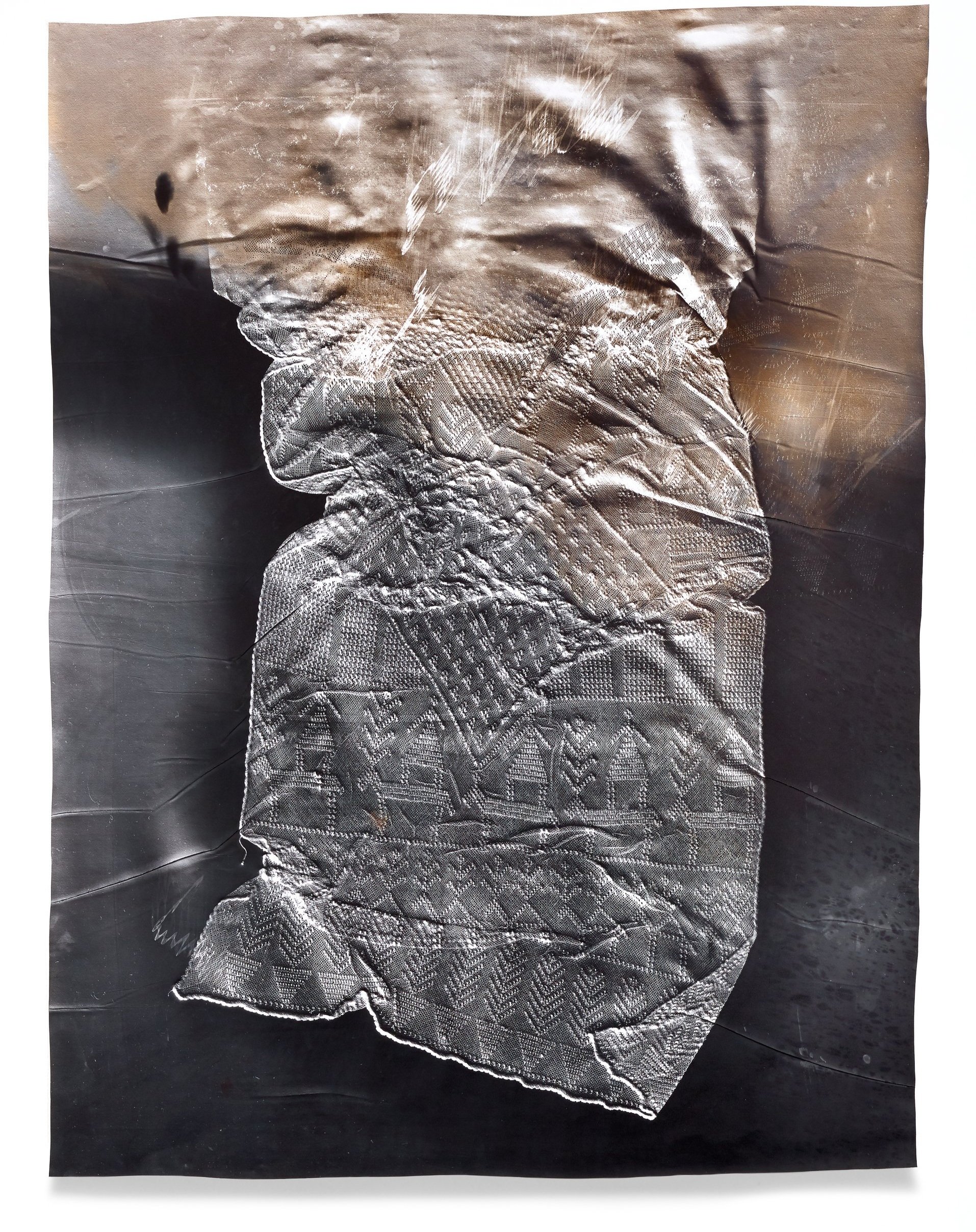   Kingdoms are Clay 1,  2018 Photographic relief (embossed silver gelatin photogram, selenium and sepia toned) Impression of assuit shawl made of linen and silver (Egypt, 1920s) 42 x 32 in 