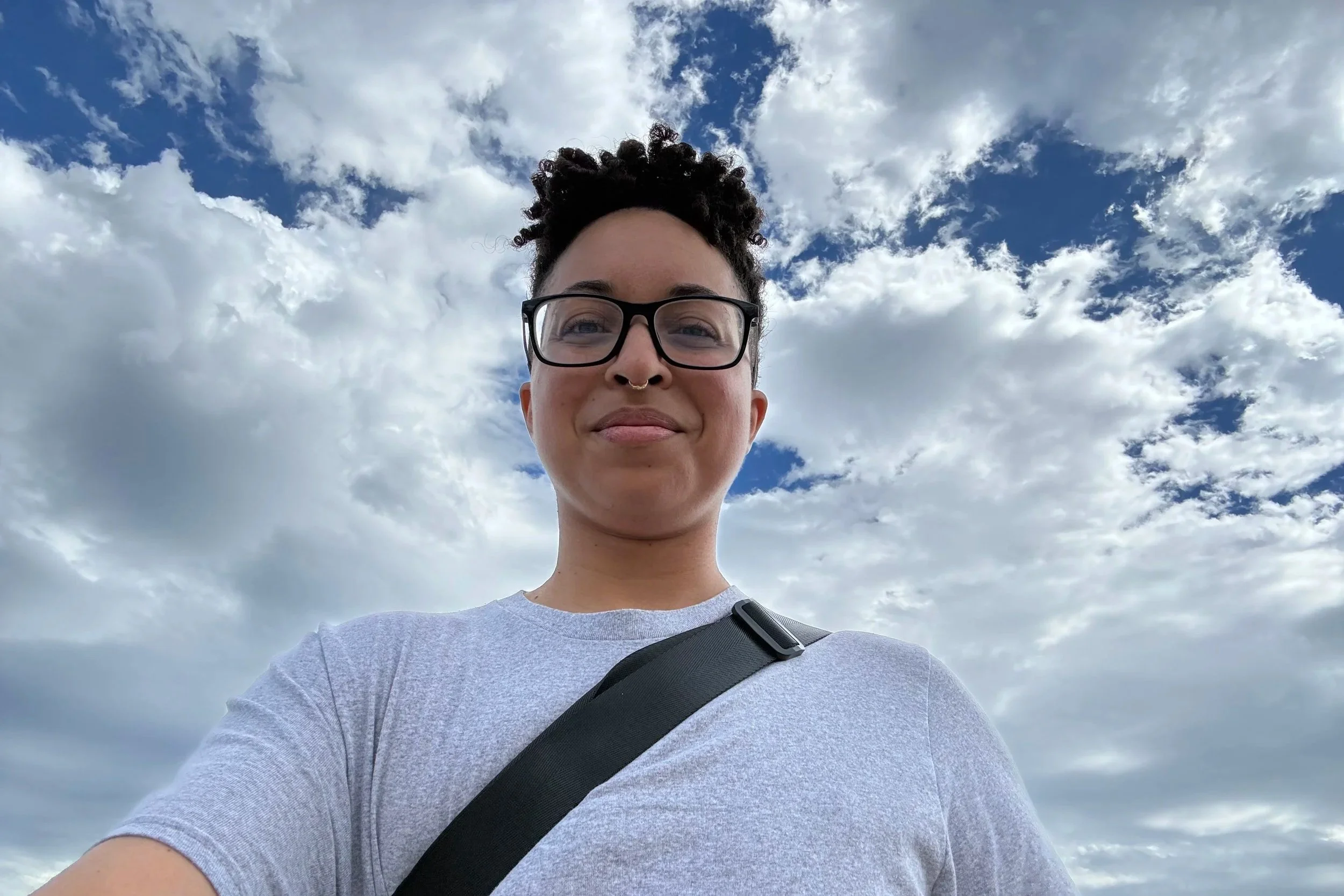 Chan with a backdrop of the blue sky with clouds