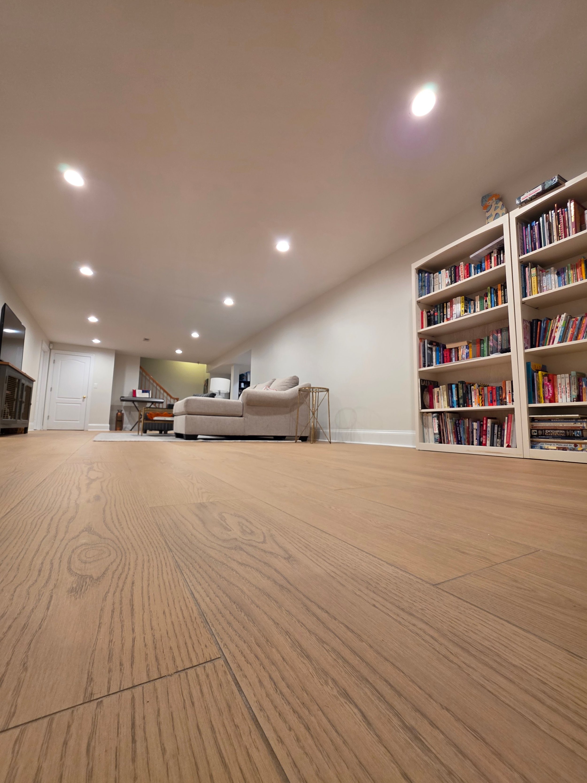 Low view showing wood-grain tile texture and grout joints.