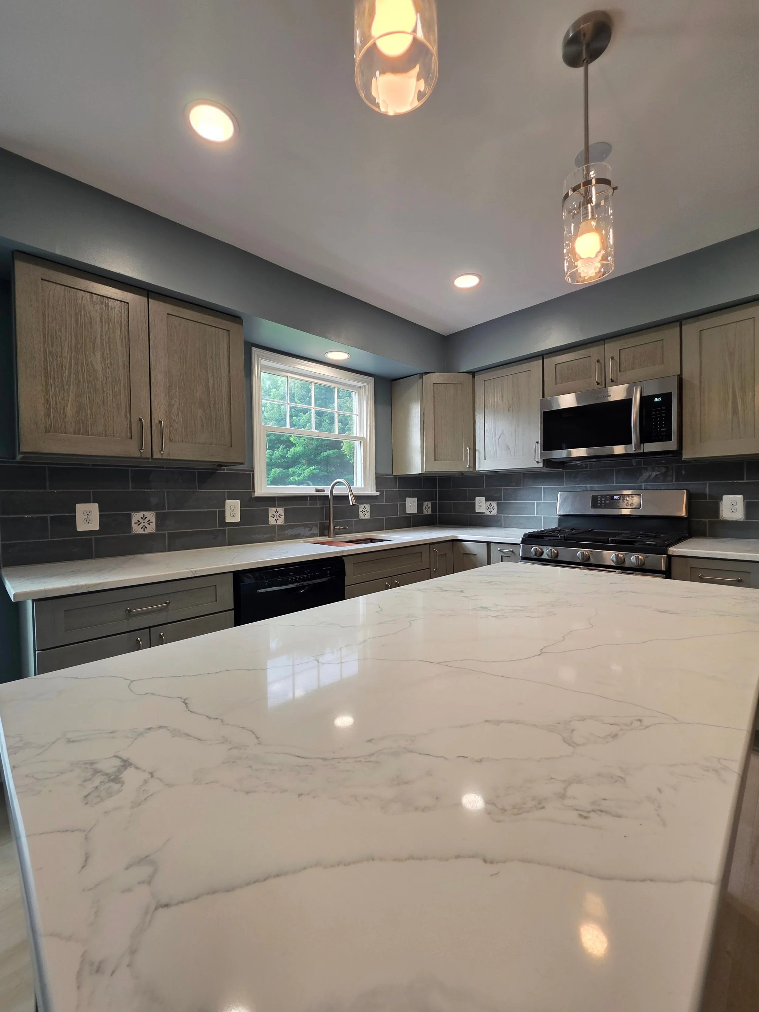 Light island countertop with subtle veining.