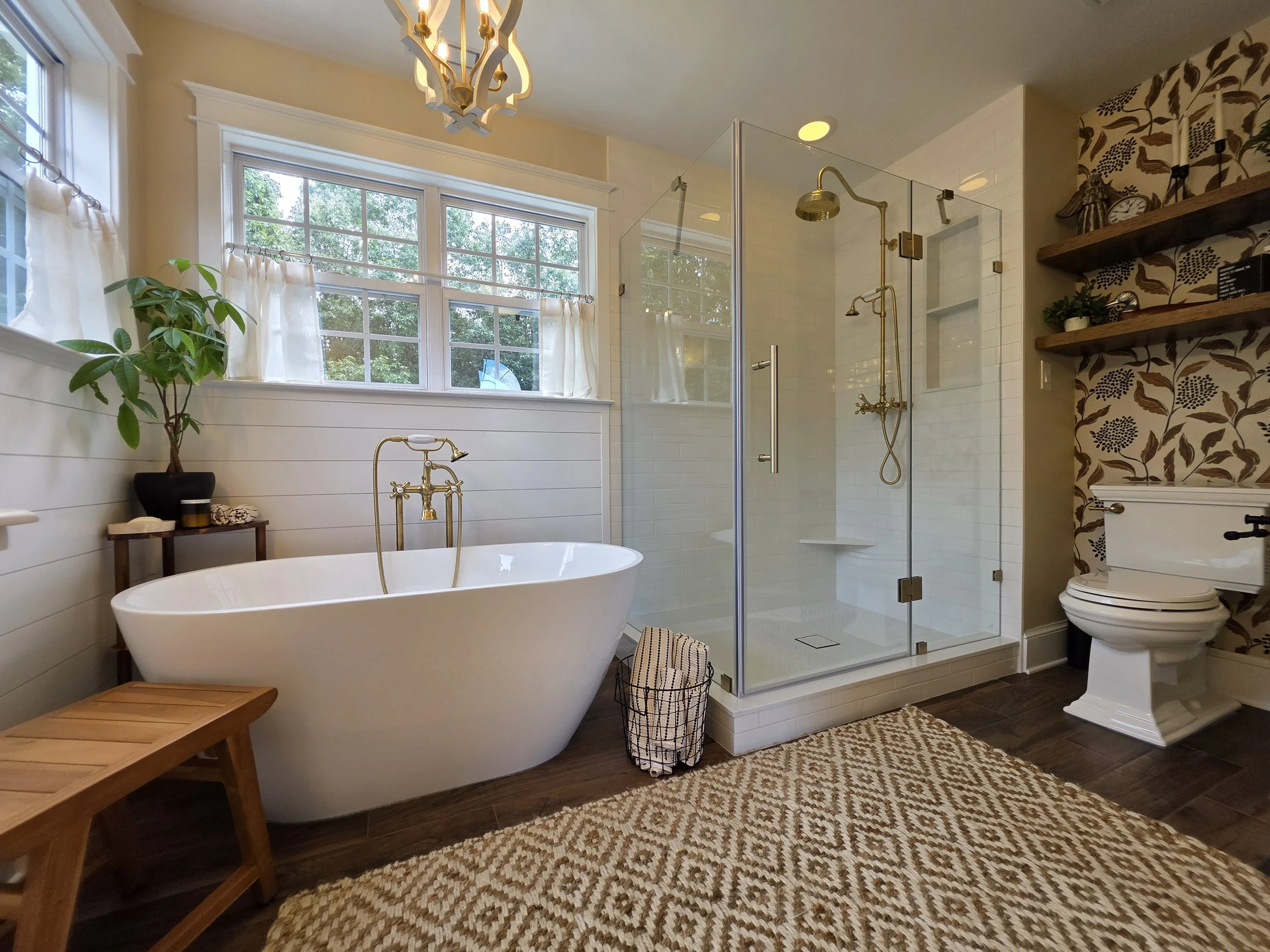 Christina and Michael’s master bathroom with freestanding tub and glass shower.