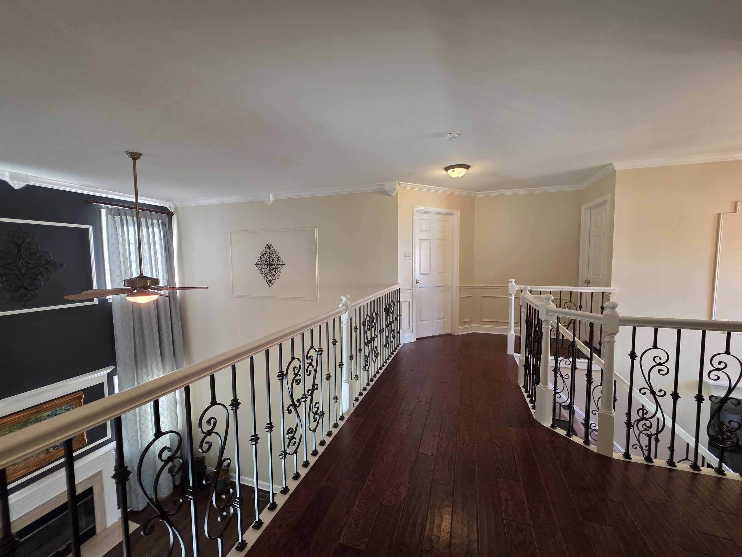 Upstairs hallway walls and trim overlooking living room.
