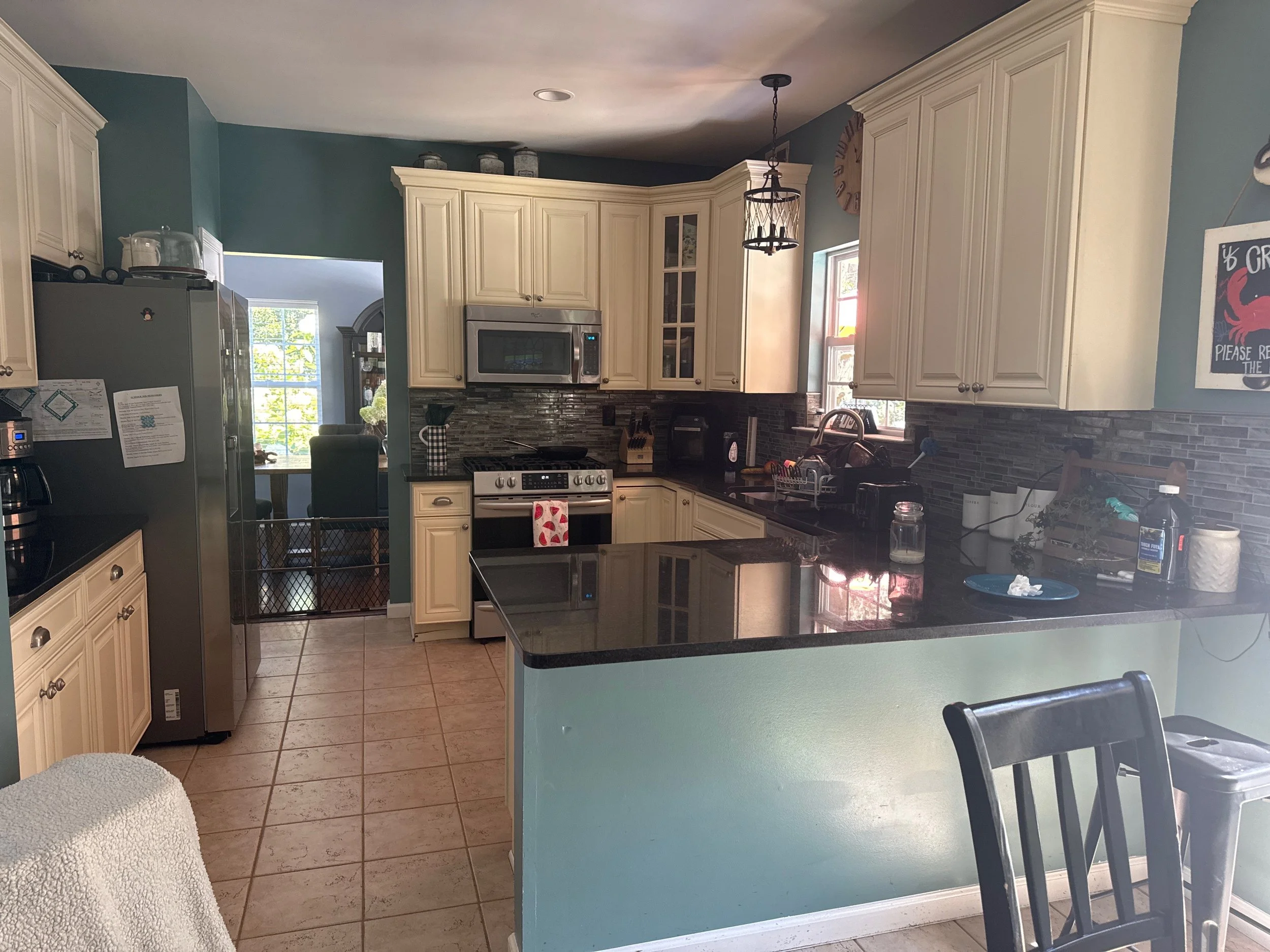 Kitchen before the backsplash and flooring update.