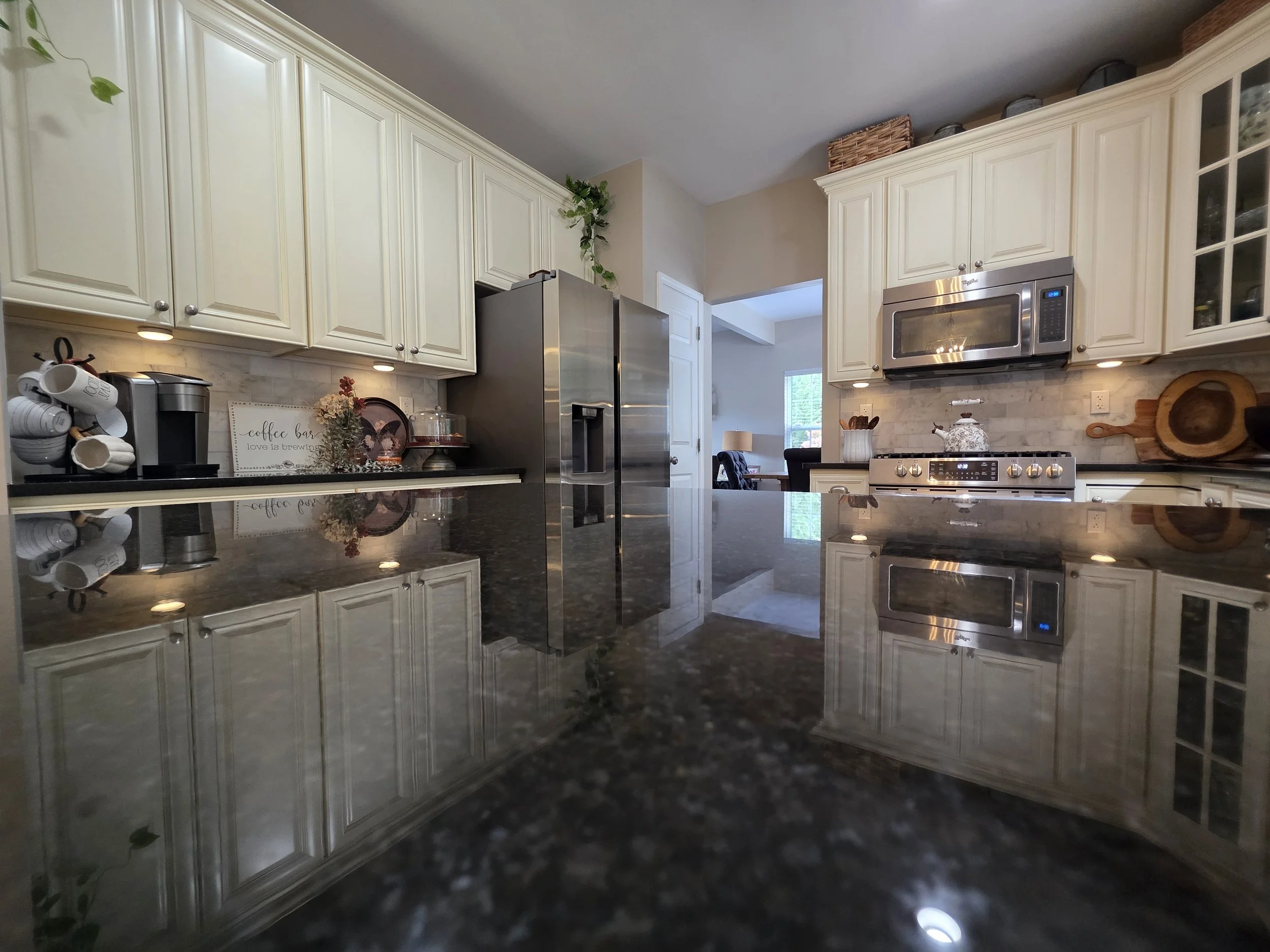 Backsplash tile around the range and refrigerator area.
