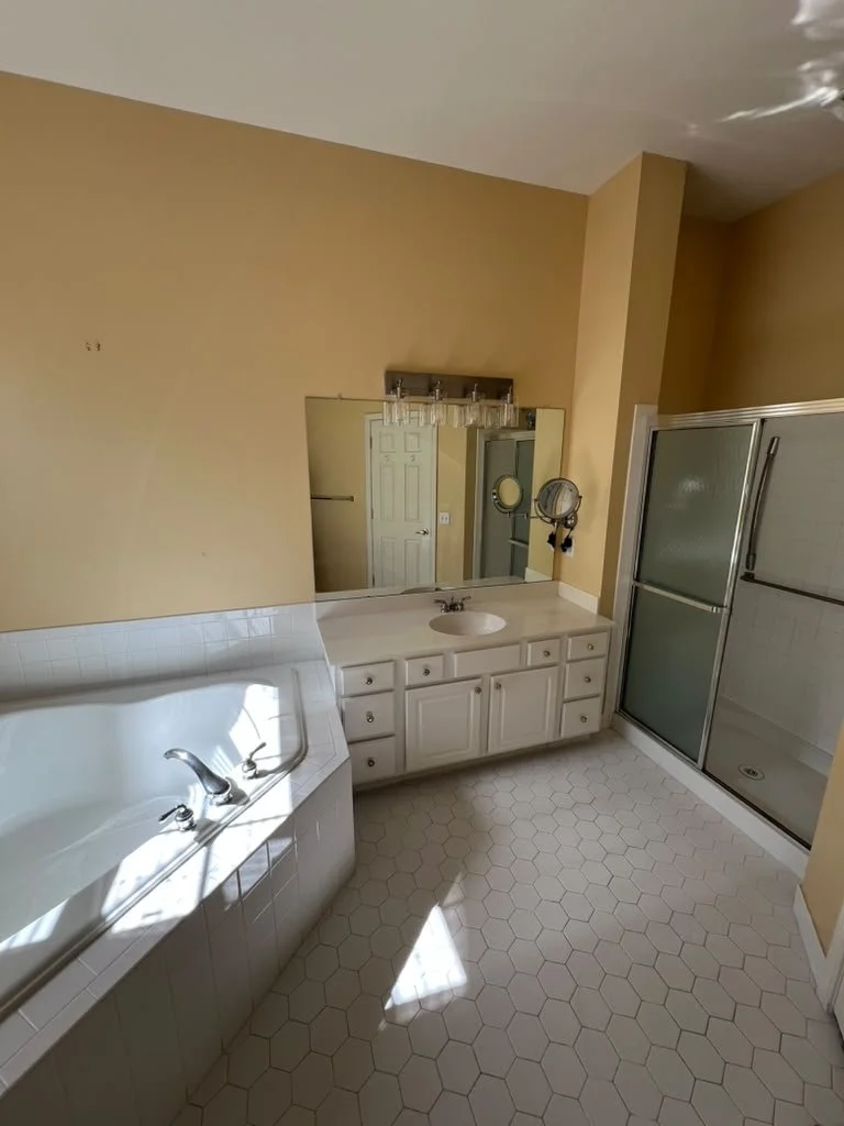Master bathroom before renovation with built-in tub.