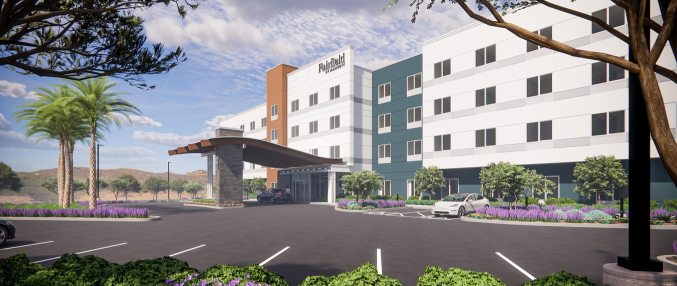 Rendering of the four-story Fairfield Inn and Suites at Lamb Boulevard and Nexus Way in North Las Vegas with a covered entry, palm trees and a parking lot