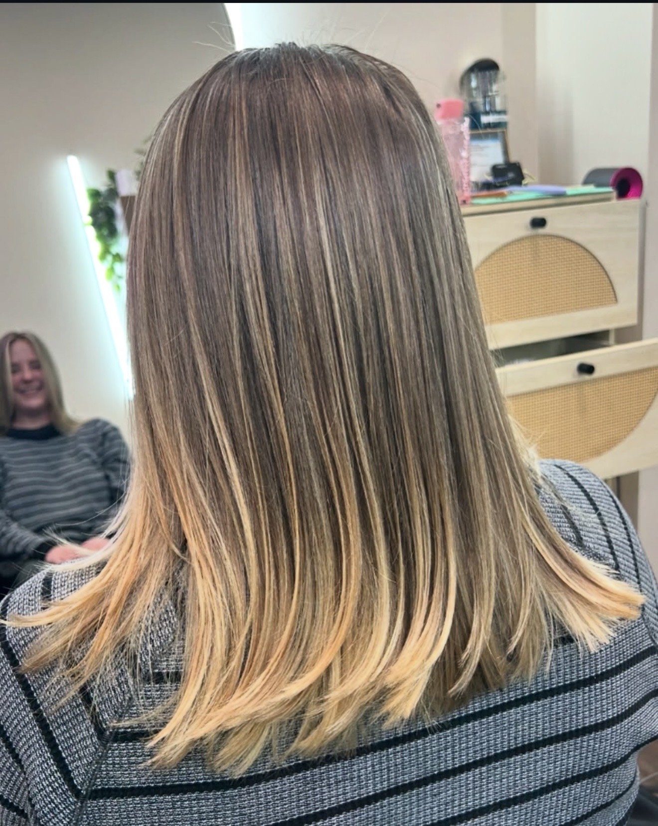 Salon customer with new long natural braids