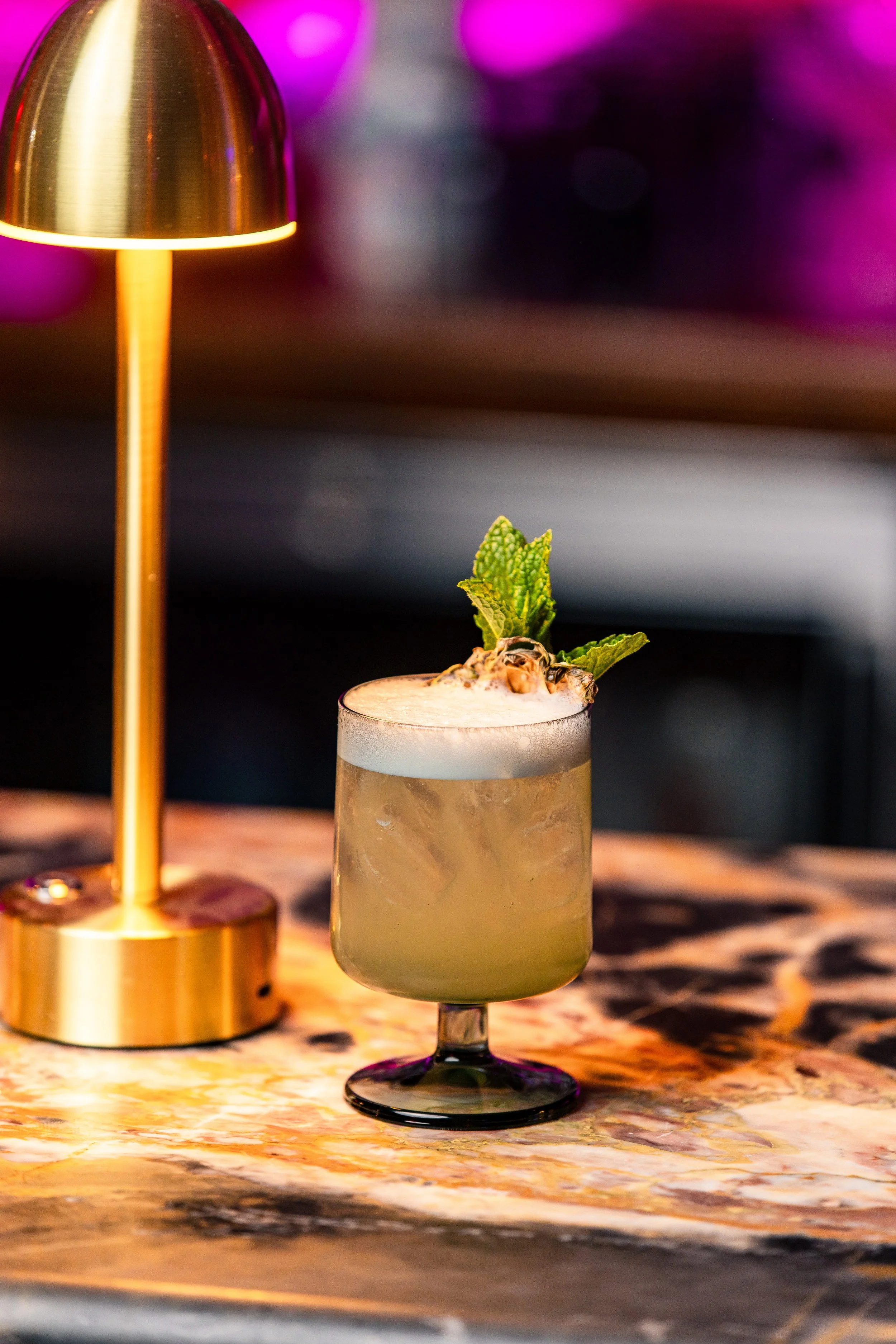 A martini cocktail with olives