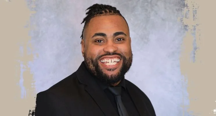 ADHD-ish blog, Dr Dante Assad Williams smiling in black suit, Neurodivergent Women: Better Communication and Leadership, communication and leadership, neurodivergent women, perfectionism adhd