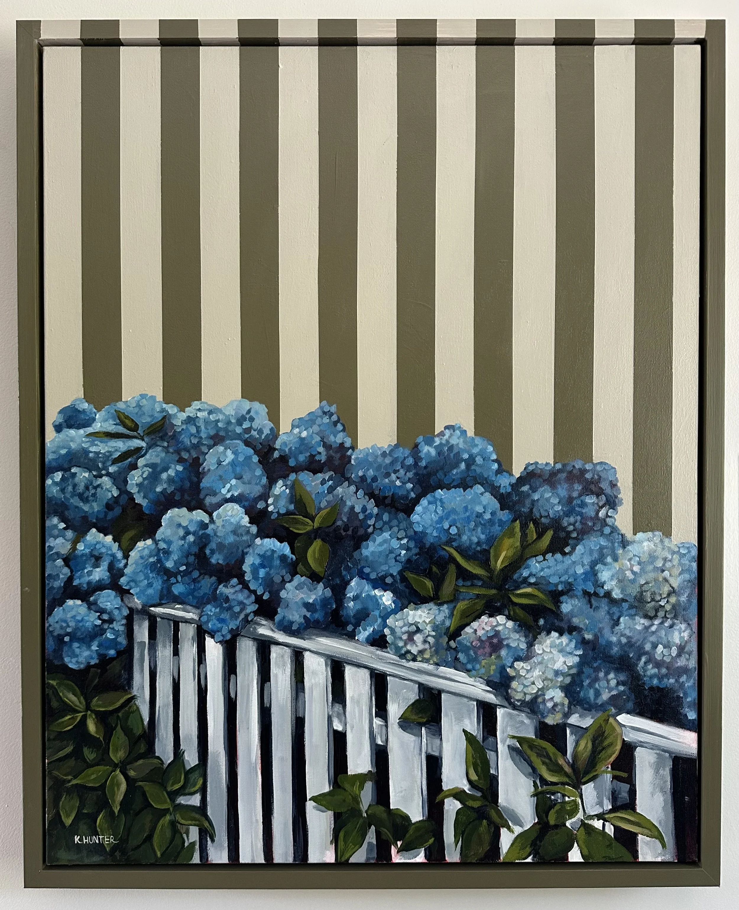 Painting of blue hydrangea flowers in front of a white picket fence with a background of vertical beige and green stripes.  new england, coastal art, coastal inspired, new england summer
