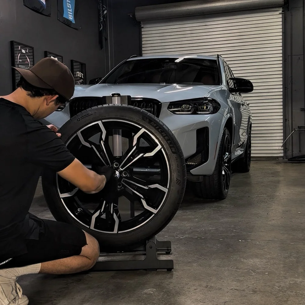 Protek technician detailing a wheel in the Santa Fe Springs studio