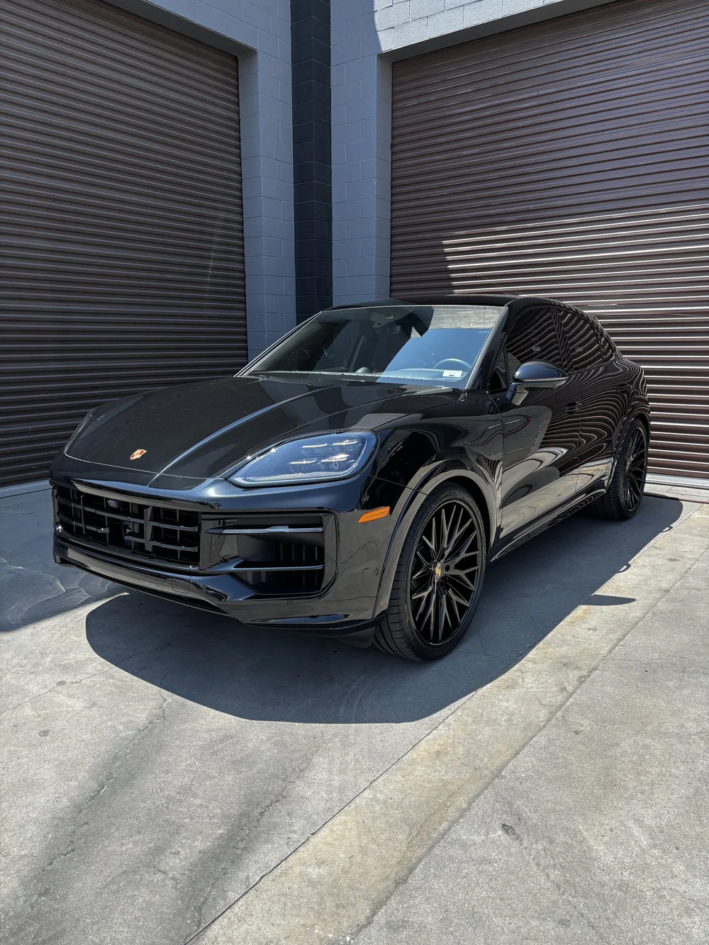 Black Porsche SUV with a fresh ceramic coating