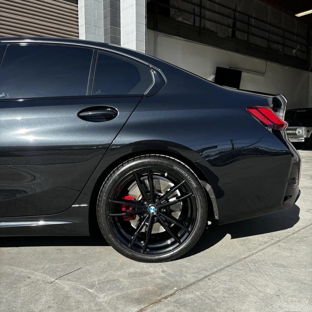 Black BMW sedan with tinted windows