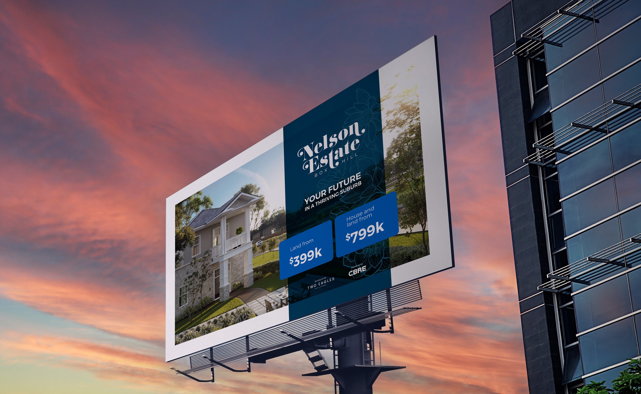 Billboard featuring a real estate advertisement for Nelson Estate Box Hill with pricing details for land starting at $399k and house and land from $799k, set against a sunset sky and beside a modern building.